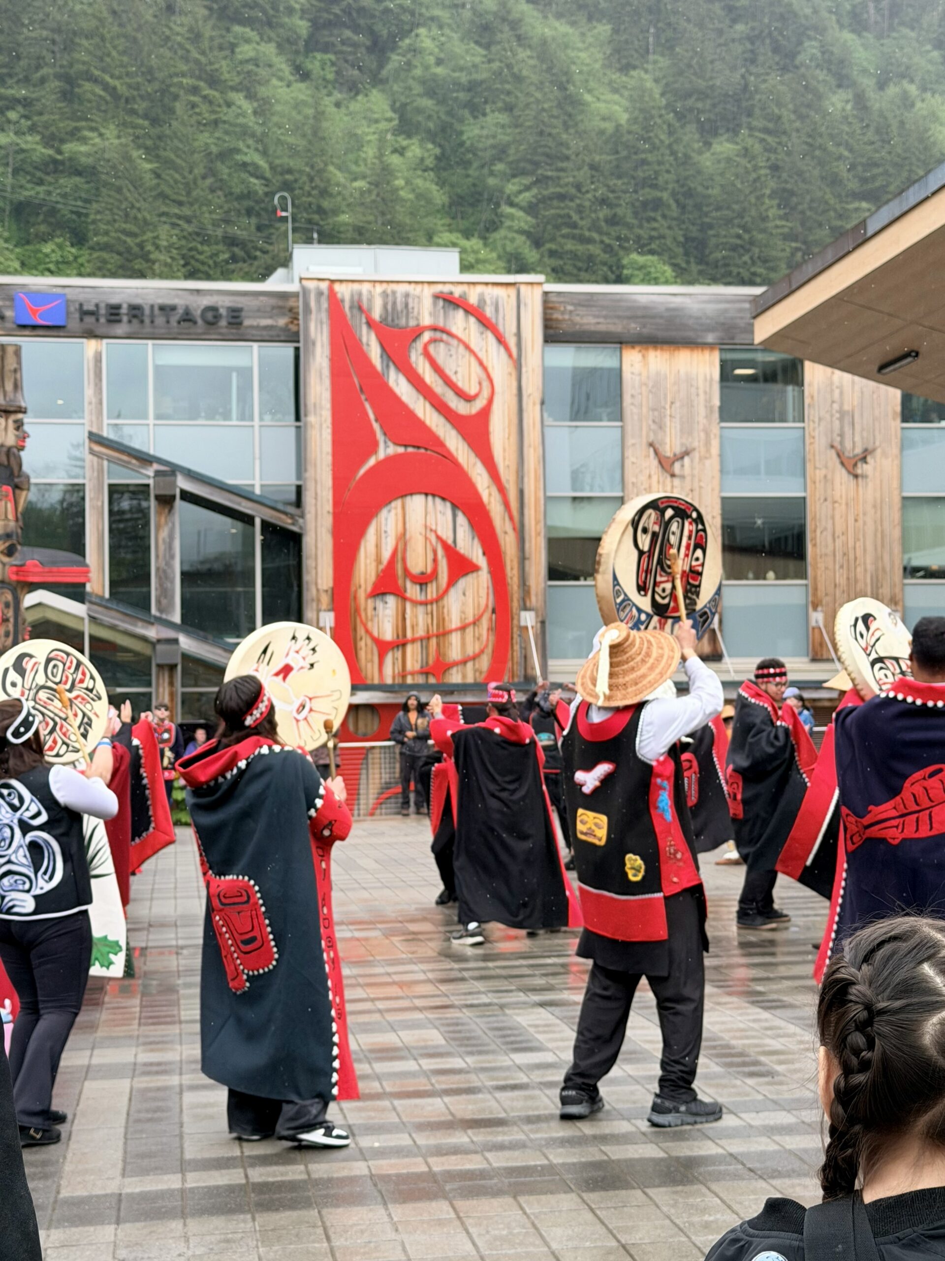 Alaska dance group with drums raised